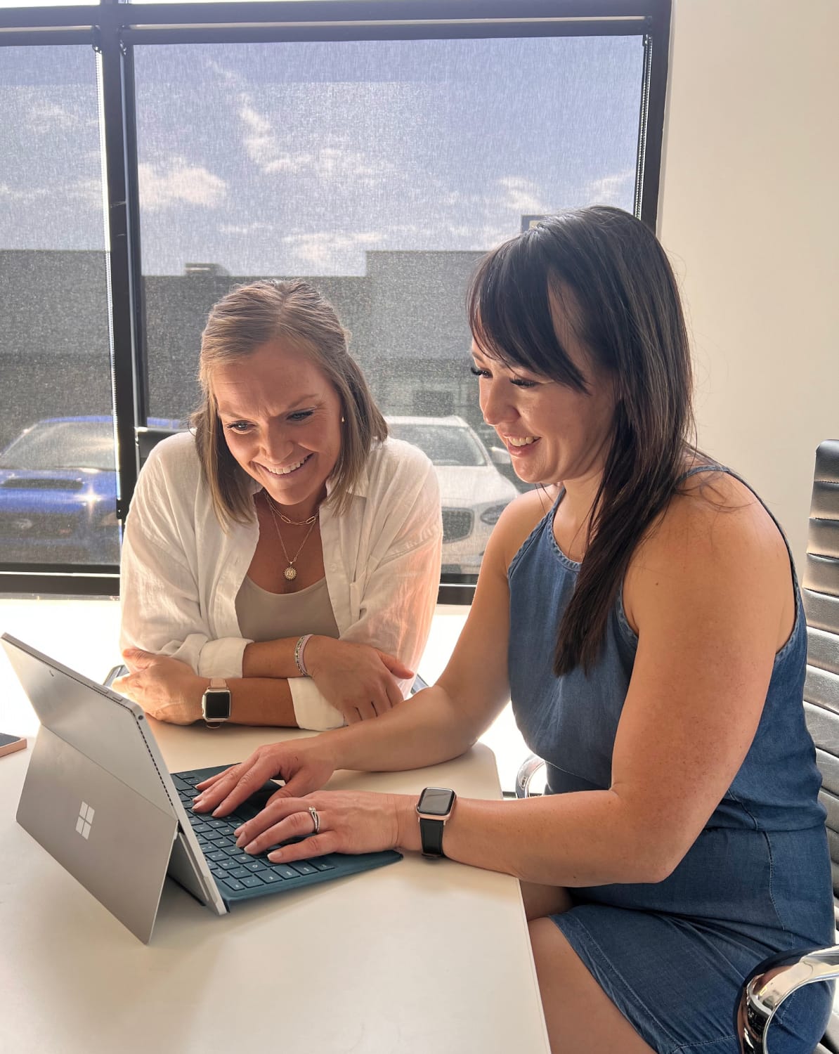 Lynea collaborating with a client over a tablet