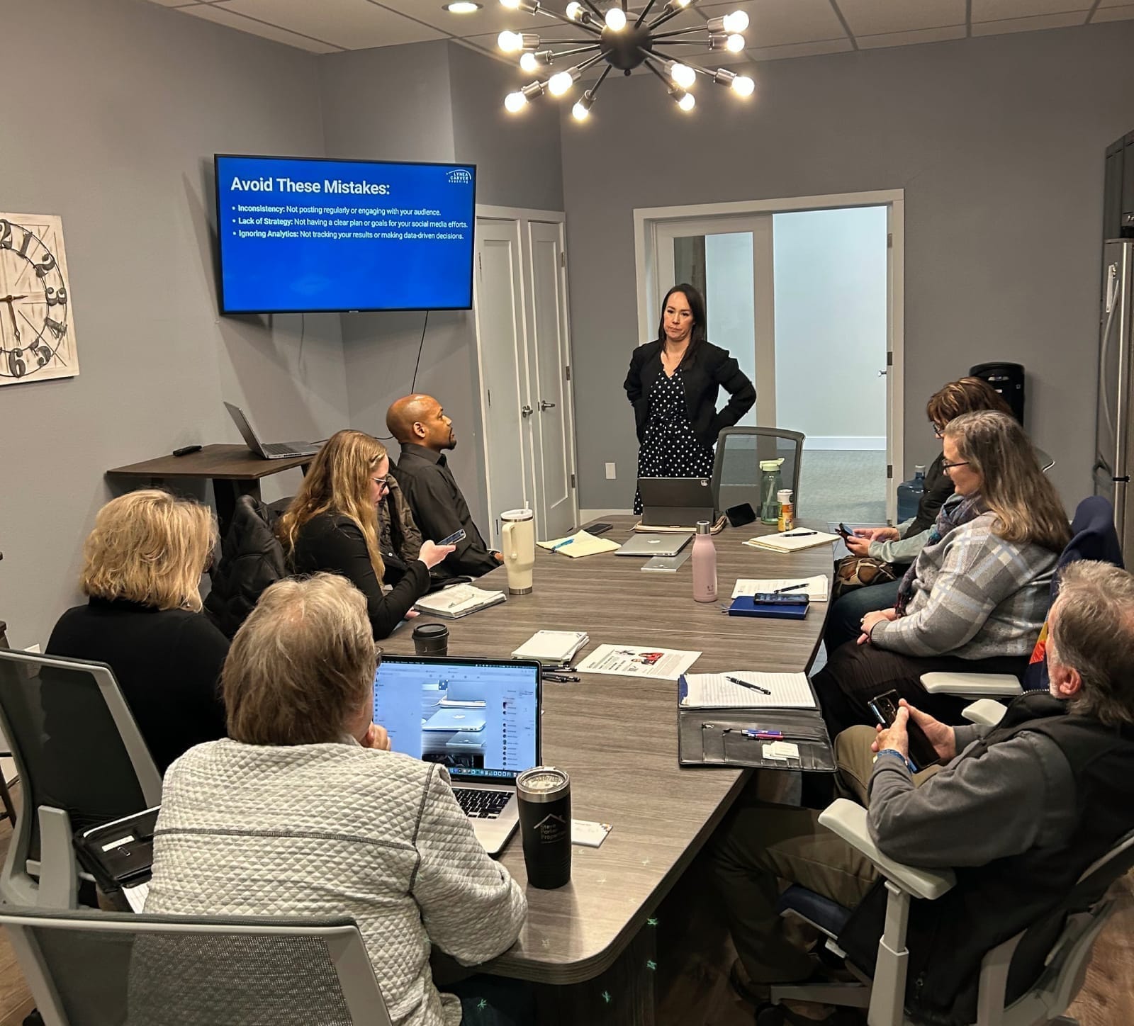 Lynea presenting the listing system to a room of agents